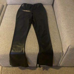 Faux leather, flare bottom pants, with slits on the inner bottom corner